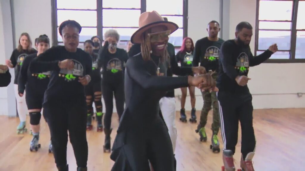 Adults take in roller skating at North Side rink